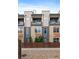 Townhome featuring a private fenced-in yard and modern facade at 3522 W 17Th Ave, Denver, CO 80204
