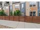 Townhome featuring a private fenced-in yard and modern facade at 3522 W 17Th Ave, Denver, CO 80204