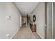 Entry hallway with a carpet runner, stairs to the upper level, and decorative console table at 3522 W 17Th Ave, Denver, CO 80204