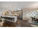 Modern kitchen featuring stainless steel appliances and a large island with bar seating at 3522 W 17Th Ave, Denver, CO 80204