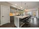 Modern kitchen featuring stainless steel appliances and a large island with bar seating at 3522 W 17Th Ave, Denver, CO 80204
