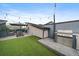 Entertain on the rooftop deck with a grill, synthetic grass and outdoor seating under string lights at 3522 W 17Th Ave, Denver, CO 80204