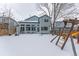 Home's back elevation and yard in winter at 1524 E Weldona Way, Superior, CO 80027