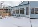 Backyard with a patio, seating area and snowy ground at 1524 E Weldona Way, Superior, CO 80027