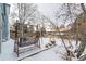 Snowy backyard with a swing and playset at 1524 E Weldona Way, Superior, CO 80027