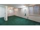 Finished basement with green carpet and large window at 1524 E Weldona Way, Superior, CO 80027