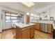 Kitchen with island, wood cabinets, and breakfast nook at 1524 E Weldona Way, Superior, CO 80027