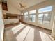 Living room with high ceilings, lots of windows, and access to the kitchen at 1524 E Weldona Way, Superior, CO 80027