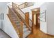 Elegant staircase with wood railings leading to the second floor at 1524 E Weldona Way, Superior, CO 80027