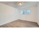 A well-lit bedroom with a large window and wood-look floors creates a serene and comfortable space at 5300 E Cherry Creek South Dr # 217, Denver, CO 80246