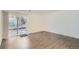 A bright living room features wood-look floors and a glass sliding door to a patio area at 5300 E Cherry Creek South Dr # 217, Denver, CO 80246