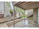 A partially covered patio provides an outdoor space bordered by mature trees and easy access to upper units at 5300 E Cherry Creek South Dr # 217, Denver, CO 80246