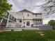 Large backyard with patio area featuring a pergola and sliding glass doors at 12196 Helena St, Commerce City, CO 80603