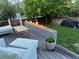 Inviting outdoor deck featuring a modern fire pit and comfortable seating area for relaxation at 12196 Helena St, Commerce City, CO 80603