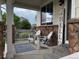 Inviting front porch with comfortable seating, perfect for relaxing and enjoying the outdoors at 12196 Helena St, Commerce City, CO 80603