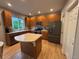 Well-lit kitchen featuring stainless steel appliances, an island, and generous counter space at 12196 Helena St, Commerce City, CO 80603