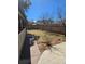 Spacious backyard with a well-maintained lawn, complemented by mature trees and a privacy fence at 1051 Jasper St, Aurora, CO 80011