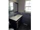 Updated bathroom featuring a dark wood vanity with a light countertop and mosaic backsplash at 1051 Jasper St, Aurora, CO 80011