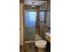 Bathroom showcasing a tiled shower with a glass door and modern fixtures, offering a spa-like experience at 1051 Jasper St, Aurora, CO 80011