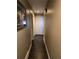 Hallway with dark wood flooring and neutral paint leading to doors at 1051 Jasper St, Aurora, CO 80011