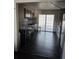Spacious kitchen with tile flooring and access to the backyard through sliding glass doors at 1051 Jasper St, Aurora, CO 80011