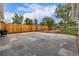 Large backyard with patio area, fire pit, and privacy fence, great for outdoor activities at 7752 Meade St, Westminster, CO 80030