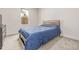 Bedroom with carpet, natural light, and a modern bed frame with wood headboard at 7752 Meade St, Westminster, CO 80030