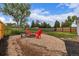 Backyard fire pit area with seating, ideal for cozy evenings outdoors at 7752 Meade St, Westminster, CO 80030