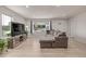 Bright living room with large windows, modern furniture, and neutral decor at 7752 Meade St, Westminster, CO 80030