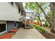 Backyard view showcasing a patio and deck with stairs to the upper level at 4643 S Vrain St, Denver, CO 80236
