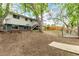Backyard showcasing a large yard, wooden fence, and deck with stairs at 4643 S Vrain St, Denver, CO 80236