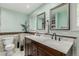 Bathroom featuring a double vanity, marble countertops, tiled backsplash, and new faucets at 4643 S Vrain St, Denver, CO 80236