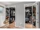 Dual walk-in closets with custom shelving and organizers create ample storage space at 4643 S Vrain St, Denver, CO 80236