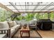 Covered deck with comfortable seating, grill, and a serene outdoor setting at 4643 S Vrain St, Denver, CO 80236