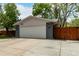 Charming home featuring an attached two-car garage, a driveway, and a well-maintained front yard with mature trees at 4643 S Vrain St, Denver, CO 80236