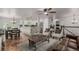 Open concept living area with view to kitchen, hardwood floors, and neutral decor at 4643 S Vrain St, Denver, CO 80236