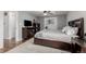 Spacious main bedroom features a ceiling fan, soft carpet, and access to the main bathroom at 4643 S Vrain St, Denver, CO 80236