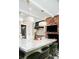 Kitchen island, seating, fireplace, and state-of-the-art appliances in an elegantly designed layout at 3355 E Eastman Ave, Denver, CO 80210