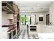 Spacious kitchen featuring stainless steel appliances, patterned flooring, and brick accents at 3355 E Eastman Ave, Denver, CO 80210