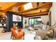 Bright and airy living room with a striking fireplace, wooden-beam ceiling, and comfortable sectional sofa at 3355 E Eastman Ave, Denver, CO 80210