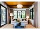 Bright living room featuring a comfortable couch, large windows, and striking ceiling design at 3355 E Eastman Ave, Denver, CO 80210