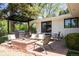 Outdoor living area with a grill, seating, dining table, and a fire pit at 3355 E Eastman Ave, Denver, CO 80210