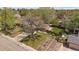 An aerial view captures the home with a spacious yard, mature trees, and a fenced backyard at 8364 Allison Ct, Arvada, CO 80005