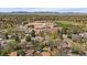 Expansive aerial view showcases the neighborhood, with lush greenery and mountain views at 8364 Allison Ct, Arvada, CO 80005