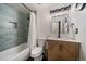 Stylish bathroom featuring tile walls, a bath and a modern vanity at 8364 Allison Ct, Arvada, CO 80005