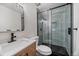 Beautiful bathroom featuring a modern glass enclosed shower and vanity at 8364 Allison Ct, Arvada, CO 80005