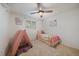 Charming bedroom with carpet floors, a bed and a cozy play tent at 8364 Allison Ct, Arvada, CO 80005