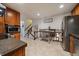 Spacious kitchen layout showing stainless steel appliances and a view of the living area at 8364 Allison Ct, Arvada, CO 80005