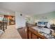 Open-concept living space with hardwood floors, seamlessly connects living room to kitchen at 8364 Allison Ct, Arvada, CO 80005