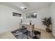 A bright office space with a large desk, neutral colors, and natural light at 8364 Allison Ct, Arvada, CO 80005